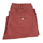 A pair of A87PE Burgundy Andorra Double Knee Canvas Carpenter Pants from Dickies Skateboarding, folded neatly, featuring a large front pocket with a visible Dickies logo patch.
