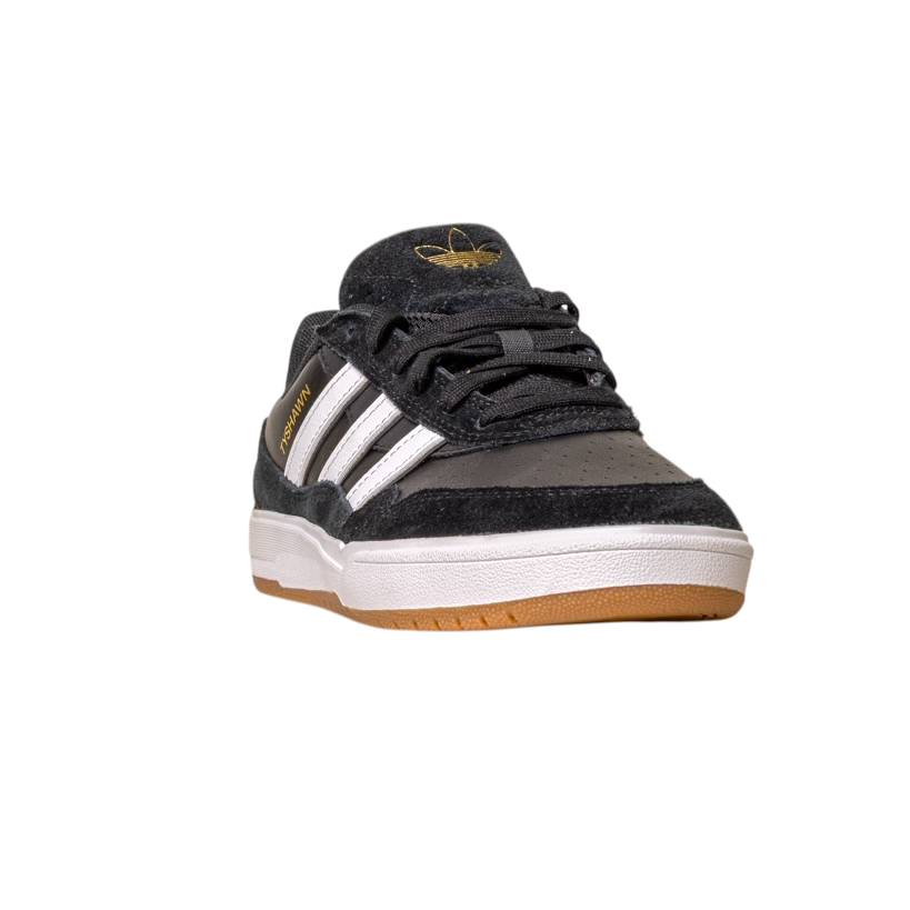 The JI 0846 Black White Gum Tyshawn 2 II Adidas Skateboarding Shoe features white stripes, gold branding, and a gum sole. Made with leather suede, it’s shown on a white background, angled to display its front and side.
