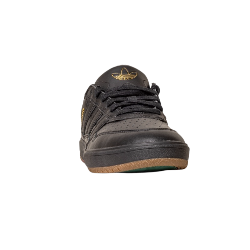 The Tyshawn 2 II Adidas Skateboarding Core Black Core Green Leather Shoe is shown from the front against a white background, featuring a gold logo, brown rubber sole, and perforated toe box.