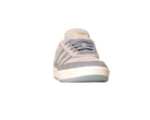 The JI0848 Granite White Tyshawn 2 II Adidas Skateboarding Leather Suede Shoe, shown from the front with a rubber sole, gray laces, and gold Adidas logo on the tongue, is ideal for fans of Adidas Skateboarding Shoes, set against a white background.