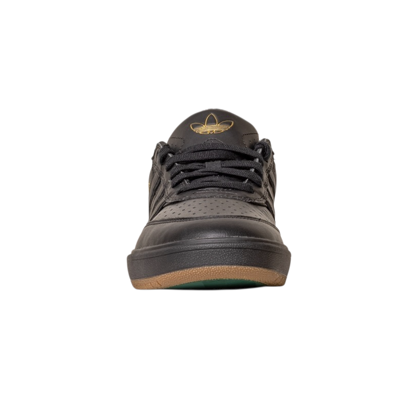 Front view of the Tyshawn 2 II Adidas Skateboarding Core Black/Core Green Leather Shoes, featuring perforated details, a gold logo on the tongue, and a brown outsole, displayed on a white background.