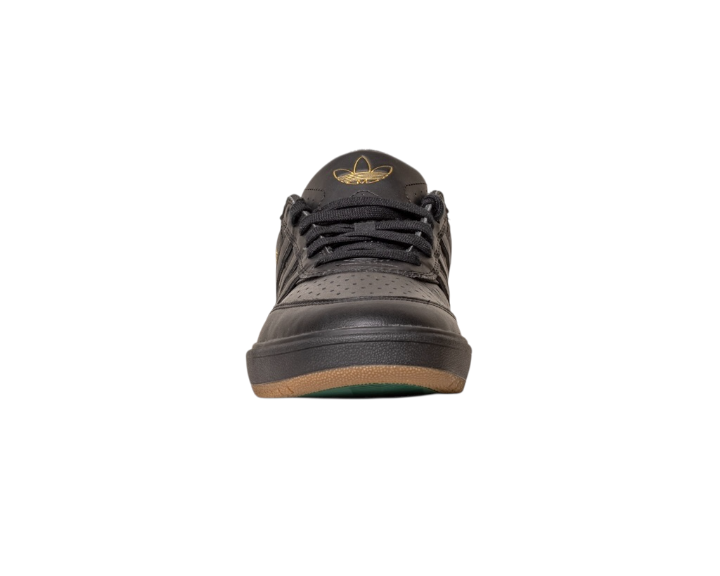 Front view of the Tyshawn 2 II Adidas Skateboarding Core Black/Core Green Leather Shoes, featuring perforated details, a gold logo on the tongue, and a brown outsole, displayed on a white background.