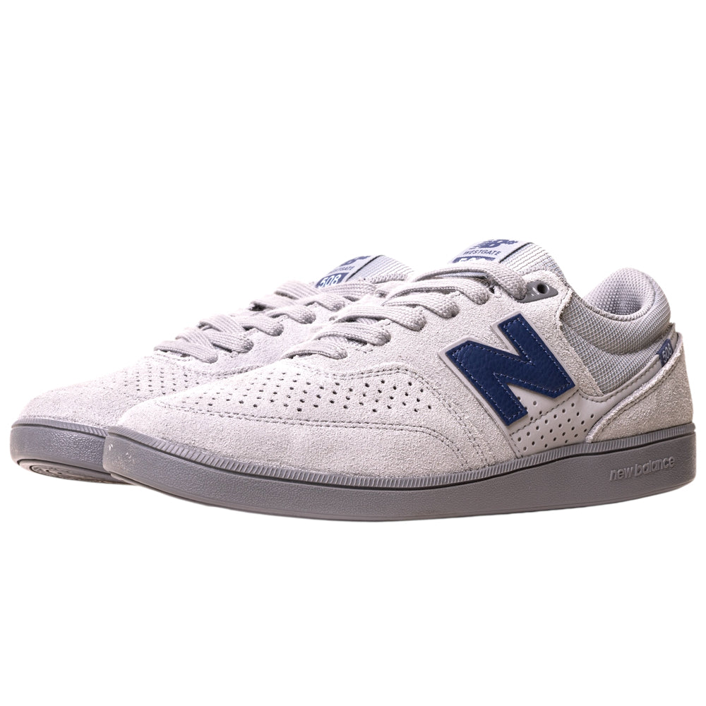 A pair of 508ICY Grey Navy New Balance Numeric suede skateboarding shoes featuring perforated light gray uppers, dark blue N logos, gray laces, and gray rubber soles.