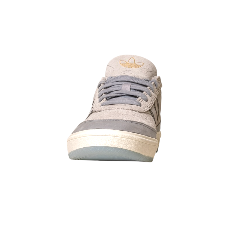 A front view of the JI0848 Granite White Tyshawn 2 II Adidas Skateboarding shoe in grey with a beige sole on a white background. The Adidas logo appears on the tongue, showcasing its classic leather and suede skateboarding design.