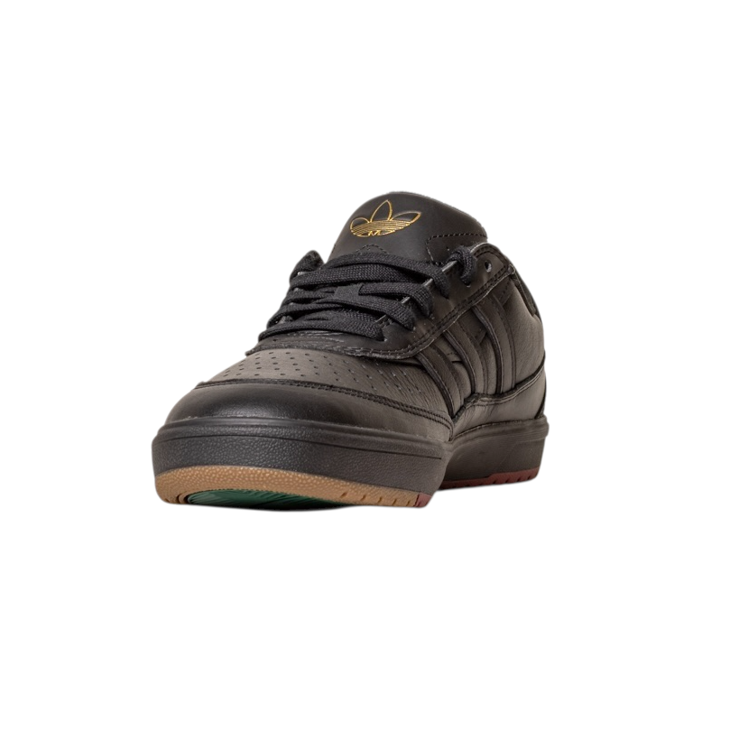 The Tyshawn 2 II Adidas Skateboarding shoes in Core Black and Core Green feature perforated black leather, black laces, a Tyshawn II logo on the tongue, and a sole with brown and green accents, shown front-facing on a white background.