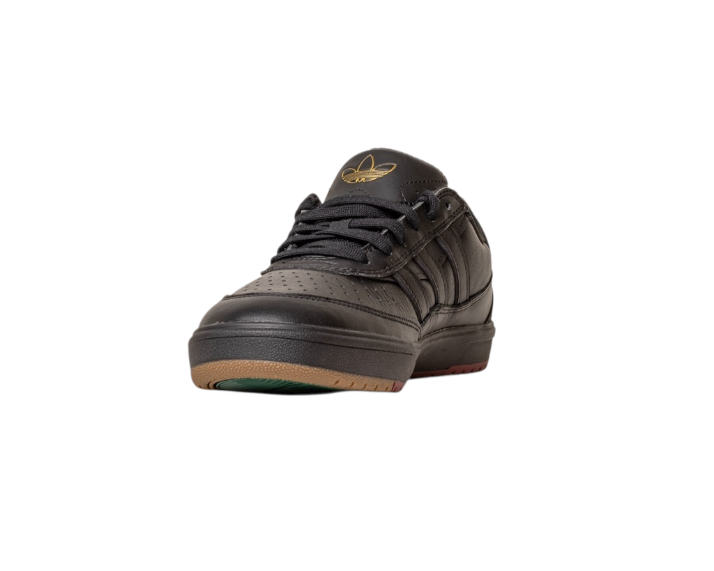 The Tyshawn 2 II Adidas Skateboarding shoes in Core Black and Core Green feature perforated black leather, black laces, a Tyshawn II logo on the tongue, and a sole with brown and green accents, shown front-facing on a white background.