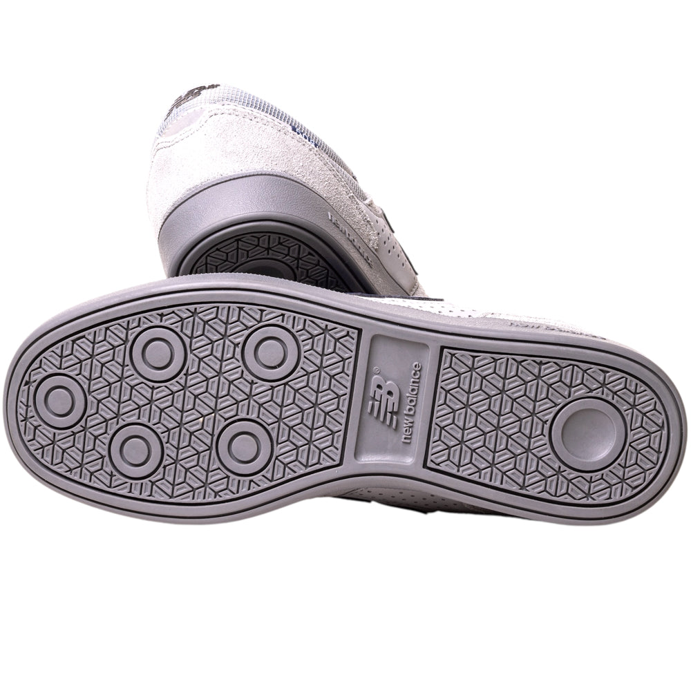 A close-up of the soles on the 508ICY Grey Navy New Balance Numeric Suede Skateboarding Shoes, showing the circular and geometric grey rubber tread patterns featured on this NB Numeric model.