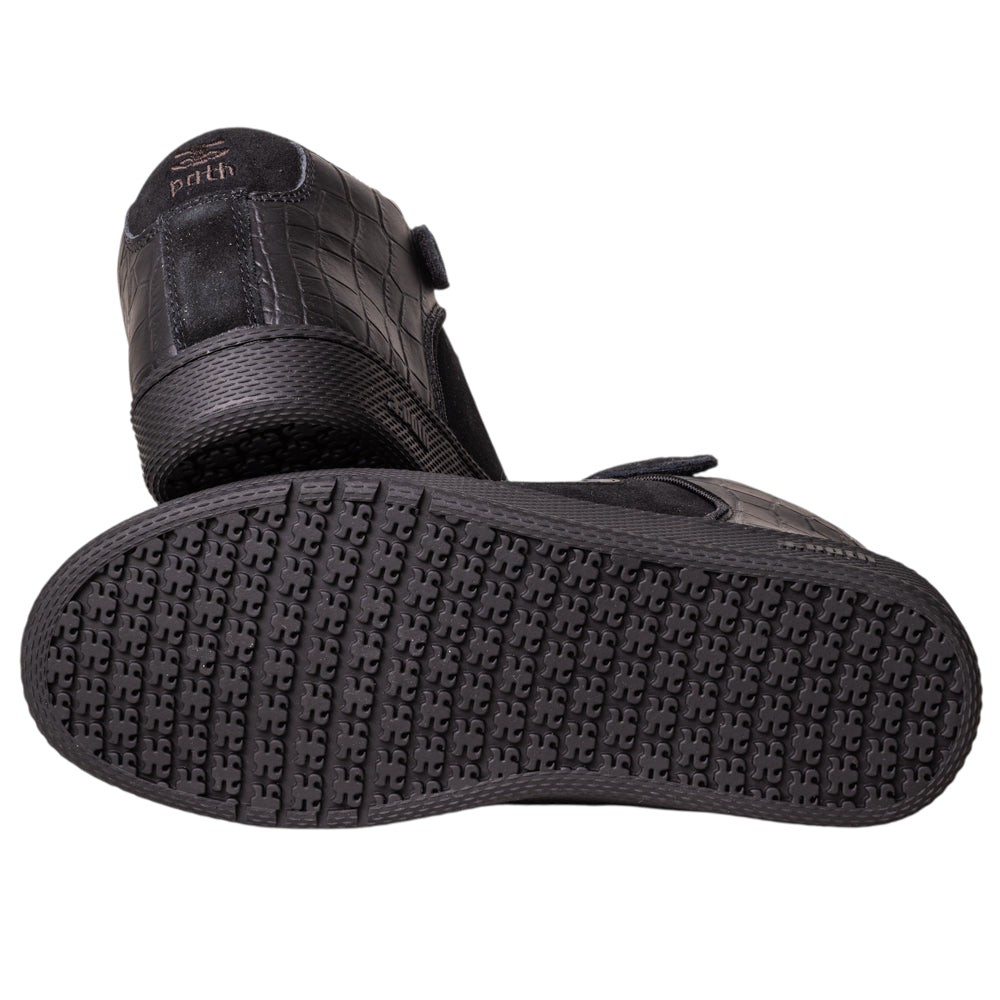 A pair of Grasshopper Black Croc Leather I Path skateboarding shoes—one on its side reveals a textured rubber sole, the other upright shows a patterned upper with "prth" on the heel.