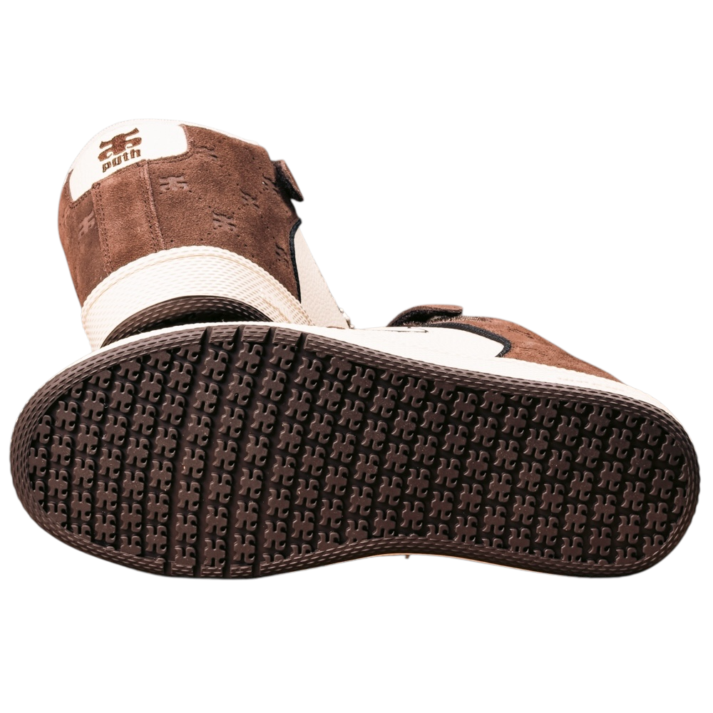 The Grasshopper Brown Suede Leather I Path Shoes for skateboarding are mid-top sneakers in brown and white, shown from the back and bottom, with textured patterned soles and a logo on the heel.