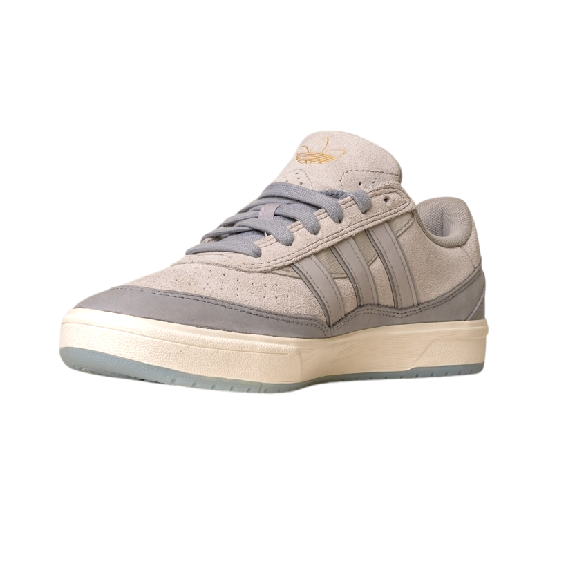 The JI0848 Granite White Tyshawn 2 II Adidas Skateboarding Shoe features beige and gray leather and suede, a cream sole, gray laces, and a gold Adidas logo on the tongue, shown against a white background.