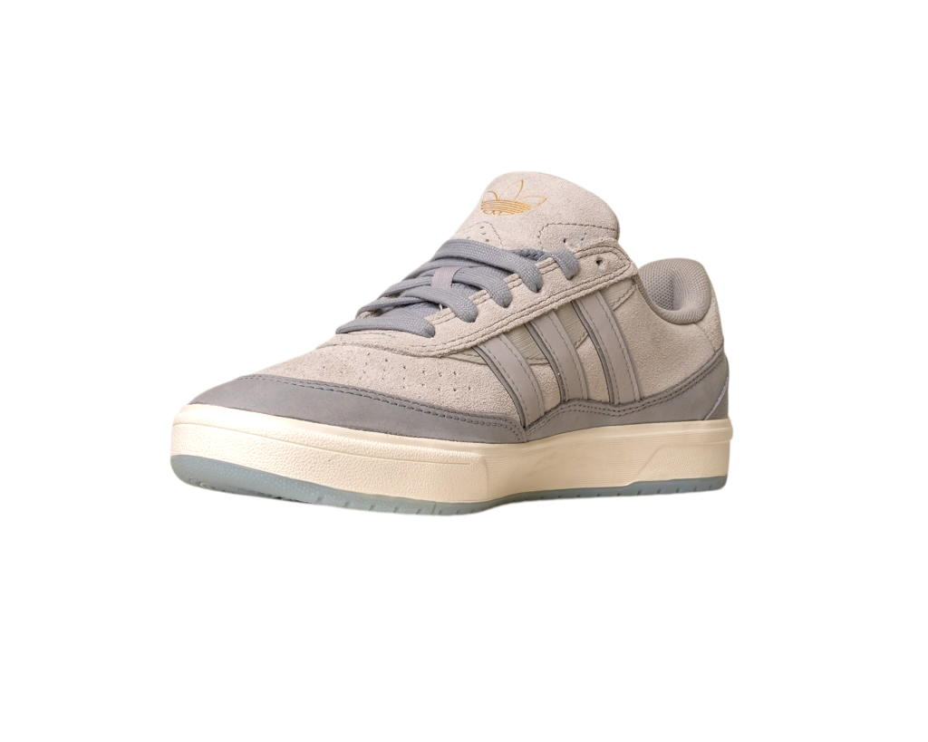 The JI0848 Granite White Tyshawn 2 II Adidas Skateboarding Shoe features beige and gray leather and suede, a cream sole, gray laces, and a gold Adidas logo on the tongue, shown against a white background.