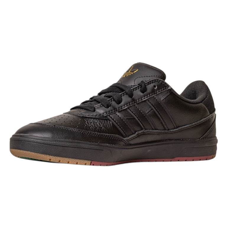 The Tyshawn 2 II Adidas Skateboarding Core Black/Core Green Leather Shoes feature a textured sole, perforated toe box, black laces, subtle gold logo on the tongue, signature side stripes, and a slightly raised heel for classic skate style.