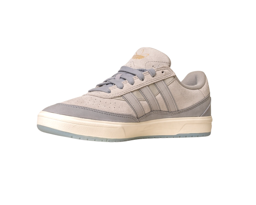 The JI0848 Granite White Tyshawn 2 II Adidas Skateboarding Shoes feature beige and gray leather and suede, signature three stripes, a gold logo on the tongue, gray laces, and a white sole—versatile skate shoes for any style.