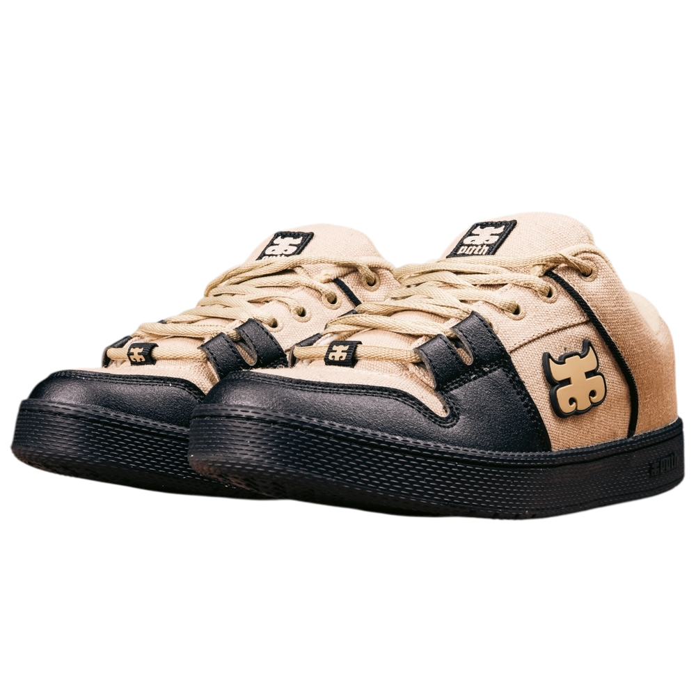 The Cricket Natural Hemp I Path Skateboarding Shoes feature a beige and black design with black soles and laces, bold logos on the tongue and side panel, cupsole construction, and an Ortholite cork insole, shown on a white background.