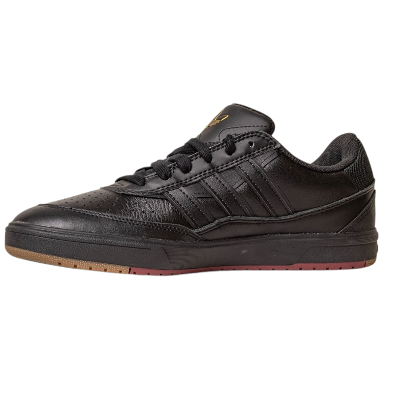 The Tyshawn 2 II Adidas Skateboarding Core Black/Core Green Leather Shoes feature a black low-top design with black laces, textured leather details, and a brown-red rubber sole, shown against a white background.