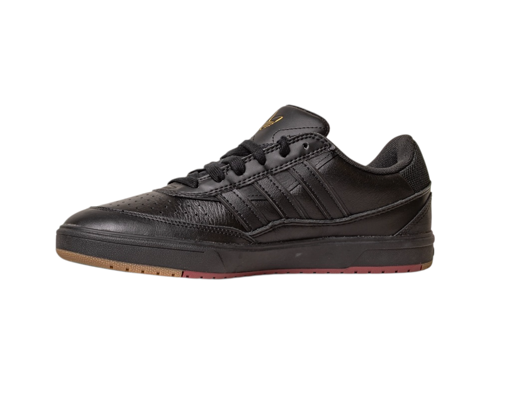 The Tyshawn 2 II Adidas Skateboarding Core Black/Core Green Leather Shoes feature a black low-top design with black laces, textured leather details, and a brown-red rubber sole, shown against a white background.