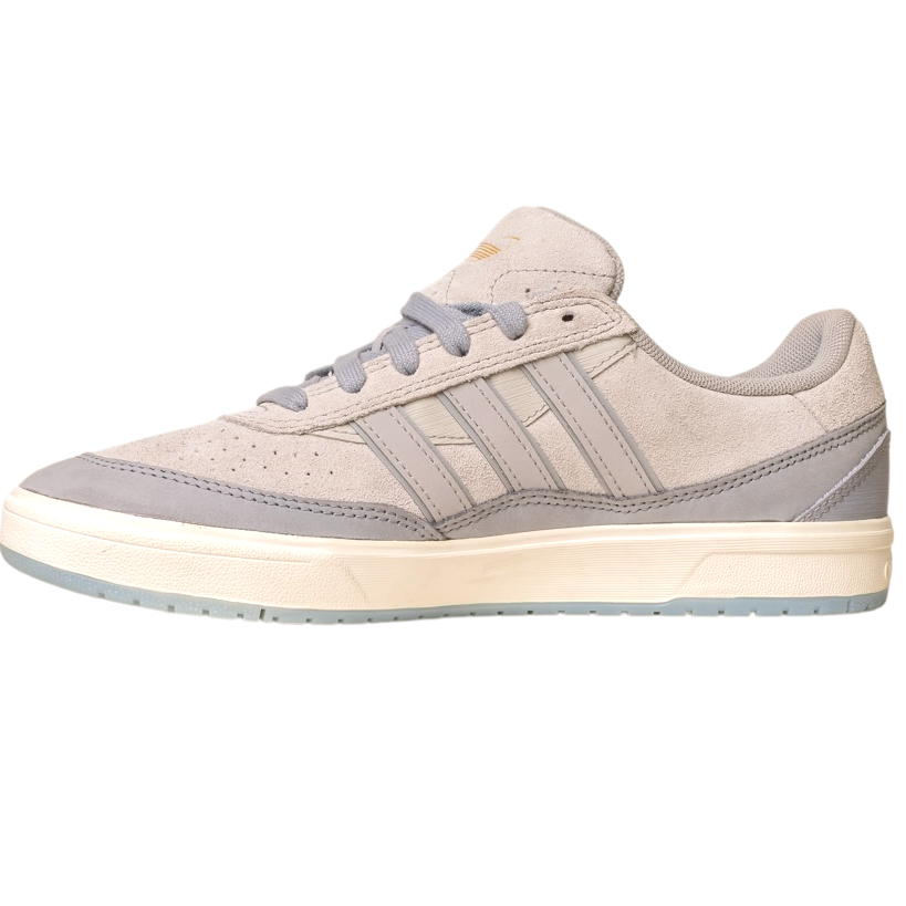 The JI0848 Granite White Tyshawn 2 II Adidas Skateboarding Shoe features a light gray suede and leather upper, gray laces, three stripes, a beige midsole, and a light blue rubber outsole on a plain white background.