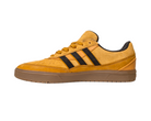 The JI0851 Mesa Black Gum Tyshawn 2 Adidas skateboarding shoe features mustard yellow leather and suede, black stripes, a brown gum sole, and signature cupsole construction inspired by the Tyshawn II.