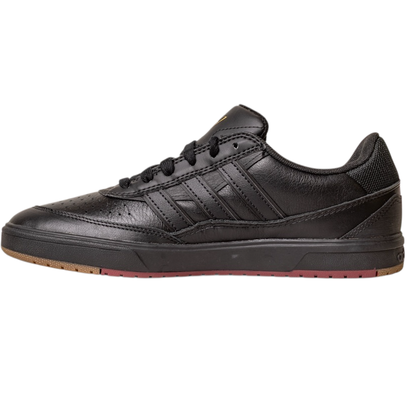 The Tyshawn 2 II Adidas Skateboarding Core Black/Core Green Leather Shoes feature black laces, a perforated toe, three black side stripes, a low-ankle design, and a mostly black sole with touches of brown and red at the front.
