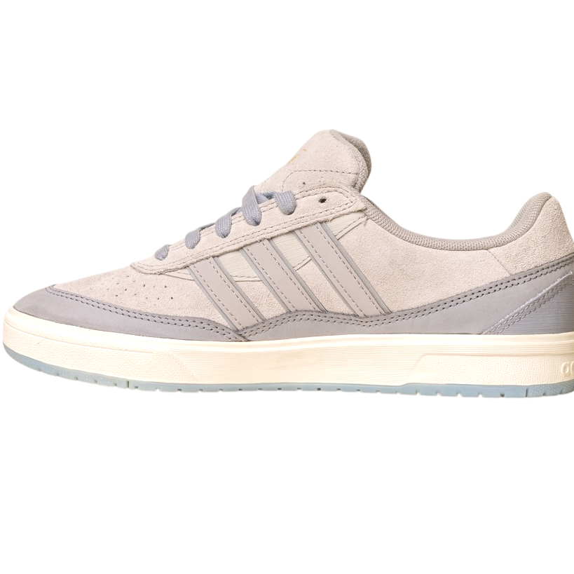 The JI0848 Granite White Tyshawn 2 II Adidas Skateboarding Shoe, shown from the side on a white background, features light gray suede, three side stripes, a white midsole, and a light gray outsole.