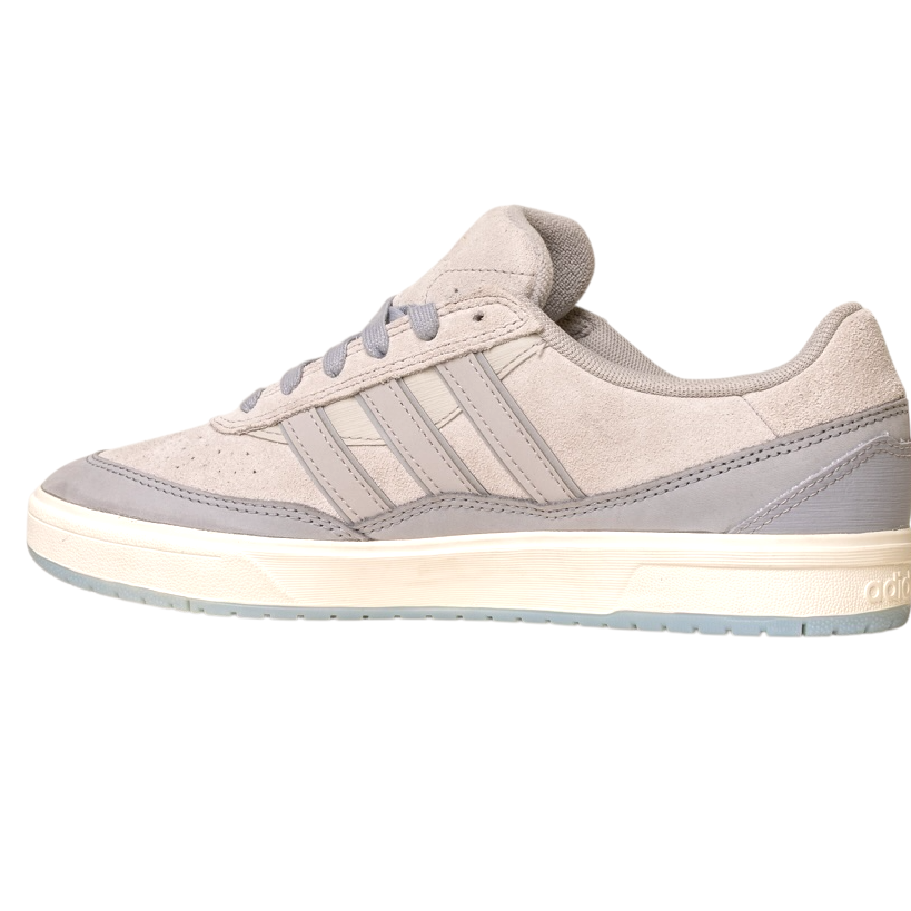 The JI0848 Granite White Tyshawn 2 II by Adidas Skateboarding is a light gray leather and suede skate shoe with gray laces, three stripes, and a white sole with a translucent light gray outsole. Shown side view on white background.