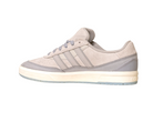 The JI0848 Granite White Tyshawn 2 II by Adidas Skateboarding is a light gray leather and suede skate shoe with gray laces, three stripes, and a white sole with a translucent light gray outsole. Shown side view on white background.