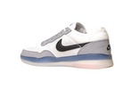 The FV8493-004 Grey White PS8 Nike SB Leather Knit Shoes feature a white and gray design, black Swoosh logo, mesh upper, and a translucent blue and white sole, displayed in side profile on a plain white background.