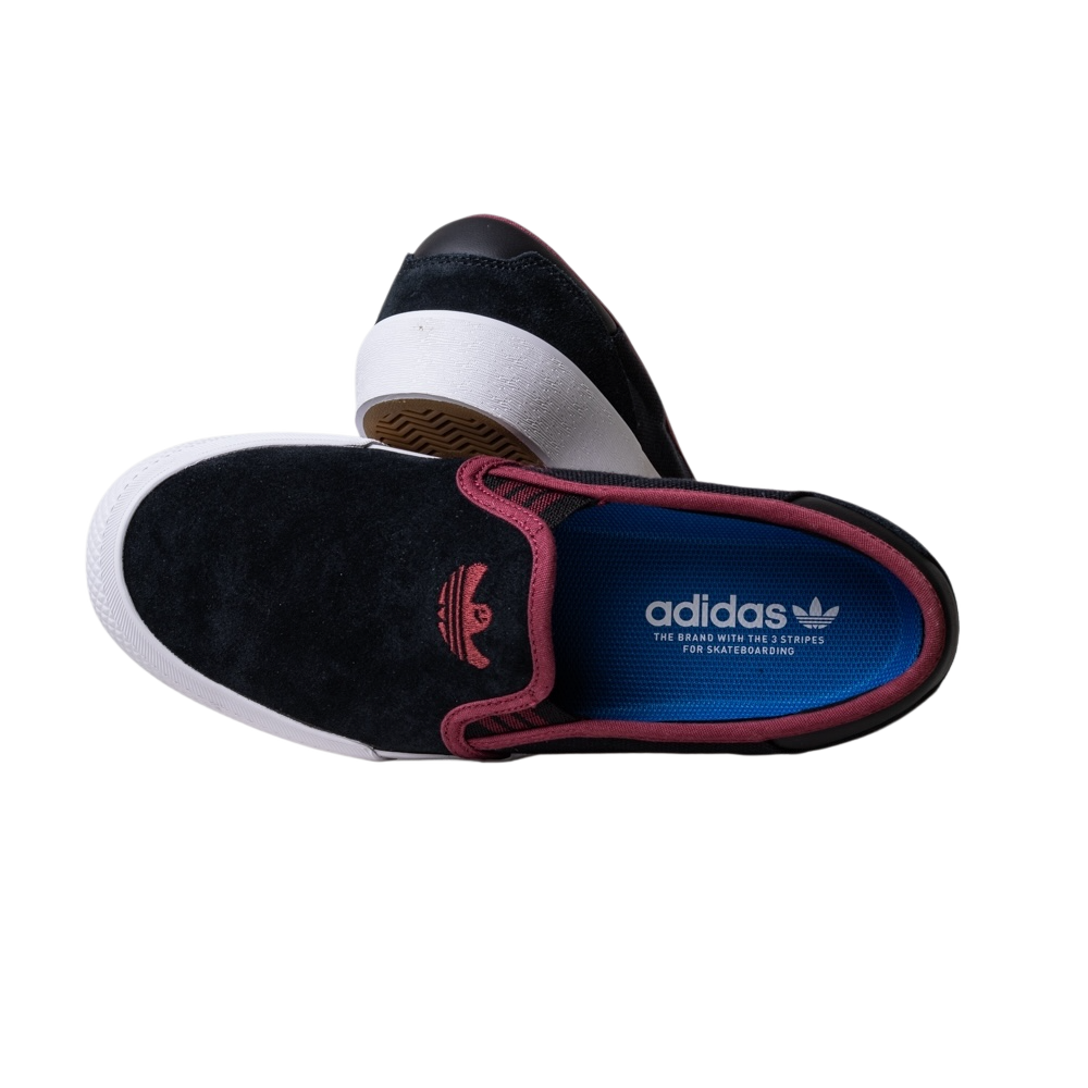 A pair of JQ1044 Black Share Shmoofoil Slip Adidas Skateboarding suede shoes with maroon trim, white soles, and blue insoles featuring the Adidas logo and text, stacked on a plain white background.
