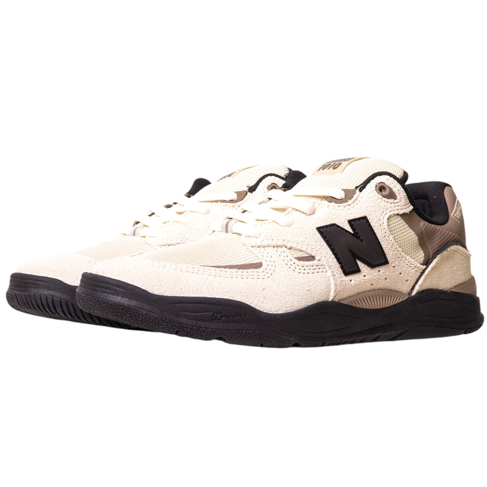 A pair of 1010NS Linen Black Tiago Lemos New Balance Numeric Suede Skateboarding Shoes with a beige and black textured upper, black rubber soles, and large black N logos on the sides, displayed on a white background.