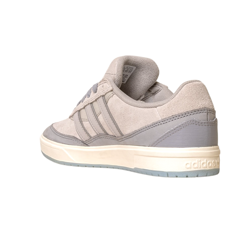 The JI0848 Granite White Tyshawn 2 II Adidas Skateboarding Shoes feature light gray suede and leather-like textures, three side stripes, and a white sole. Inspired by Tyshawn II, they blend style and performance, shown at an angle on a white background.