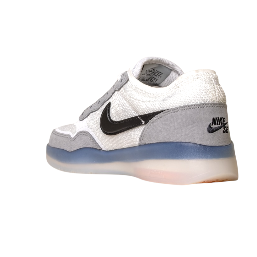 The FV8493004 Grey White PS8 Nike SB Leather Knit Shoes feature a black swoosh, mesh and suede details, Air Zoom cushioning, and a translucent sole, shown from a rear side angle on a white background.