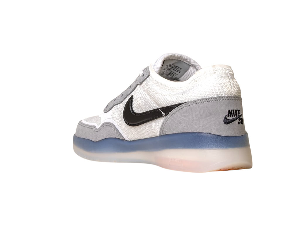The FV8493004 Grey White PS8 Nike SB Leather Knit Shoes feature a black swoosh, mesh and suede details, Air Zoom cushioning, and a translucent sole, shown from a rear side angle on a white background.