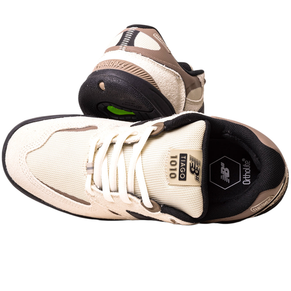 A pair of 1010NS Linen Black Tiago Lemos New Balance Numeric Suede Skateboarding Shoes featuring beige and brown suede with black accents and Ortholite insoles. One shoe is upright, showing the top; the other displays the sole and heel.