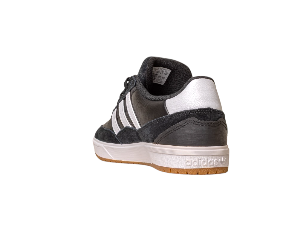 The JI 0846 Black White Gum Tyshawn 2 II Adidas Skateboarding leather suede shoe features three white stripes, a white sole, and Adidas heel logo. Shown from the back-left, it is black and white, with a classic skate design, isolated on white.