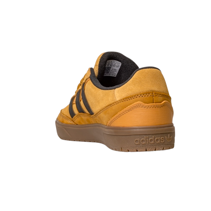 The JI0851 Mesa Black Gum Tyshawn II Adidas Leather Suede Skateboarding Shoe features yellow suede, black stripes, and a brown rubber cupsole, shown from the back/side on a white background, inspired by adidas skateboarding style.