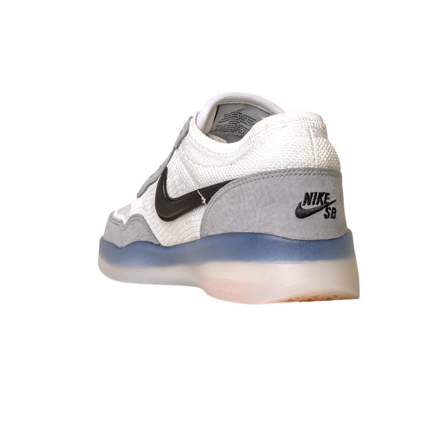 The FV8493-004 Grey White PS8 Nike SB Leather Knit Shoes feature a white and gray design, black swoosh, and light blue translucent sole with Air Zoom cushioning, shown from the back and side on a white background.