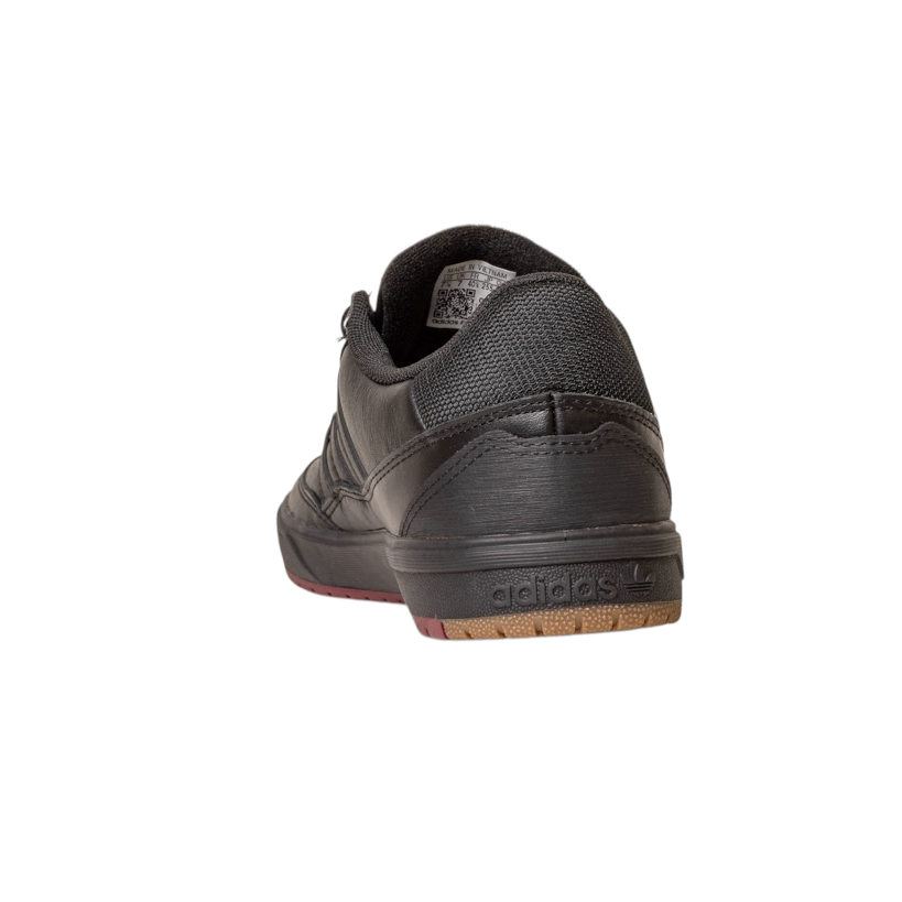 The Tyshawn 2 II Adidas Skateboarding Leather Shoe in Core Black and Core Green is shown from the back, highlighting the heel, sole, and Adidas logo against a plain white background.