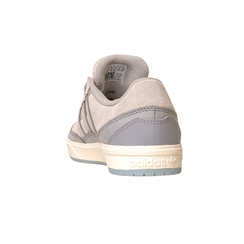 A rear view of the JI0848 Granite White Tyshawn 2 II Adidas Skateboarding Shoe shows its taupe and grey leather-suede upper, grey heel tab, and cream midsole embossed with the Adidas logo, set against a white background.