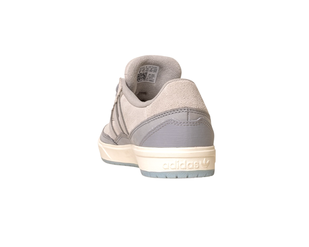 A rear view of the JI0848 Granite White Tyshawn 2 II Adidas Skateboarding Shoe shows its taupe and grey leather-suede upper, grey heel tab, and cream midsole embossed with the Adidas logo, set against a white background.