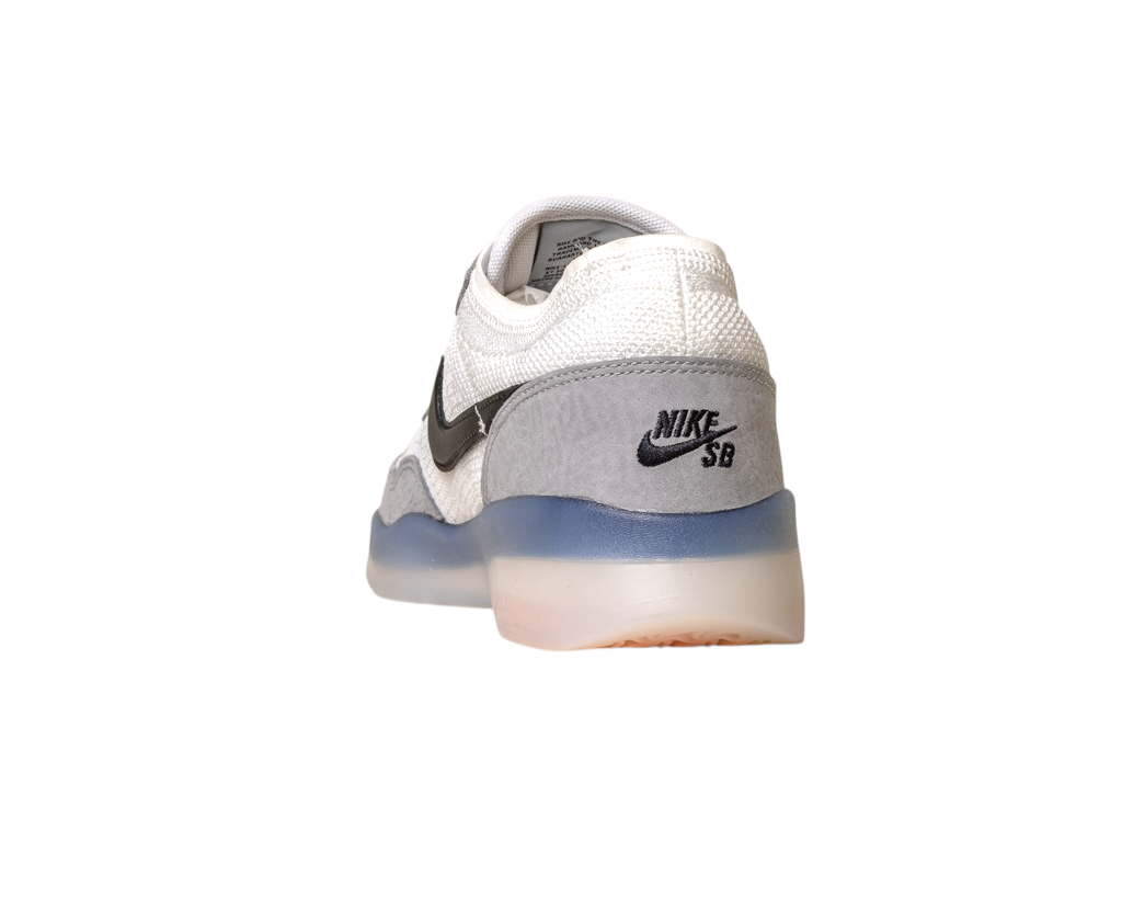 A back-right view of the FV8493004 Grey White PS8 Nike SB Leather Knit Shoes with black swoosh and logo, Flyknit leather details, translucent blue and white Air Zoom sole, shown on a white background.