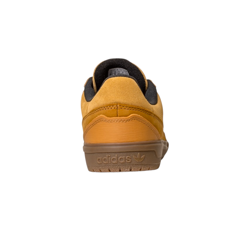 A rear view of the JI0851 Mesa Black Gum Tyshawn 2 Adidas leather suede skateboarding shoe, featuring cupsole construction, brown gum sole, black inner lining, and embossed heel logo—centered on a white background.