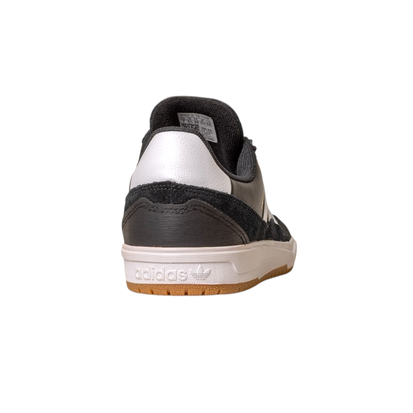 The JI 0846 Black White Gum Tyshawn 2 II Adidas Skateboarding leather suede shoe is shown from the back, highlighting its gum-colored sole and embossed Adidas logo on the heel, isolated on a white background.