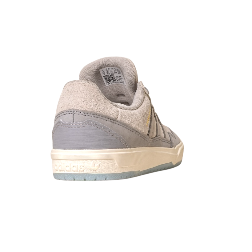 The JI0848 Granite White Tyshawn 2 II Adidas Skateboarding Shoe, shown from the back and side, features a leather and suede upper, rubber sole, Adidas logo on the heel, and is isolated on a white background.
