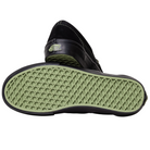 A pair of VN000EKPGSH Black Black Olive Skate Slip On Vans Suede Shoes, featuring black uppers and green waffle-patterned soles, shown with one shoe upright and the other highlighting the durable sole.