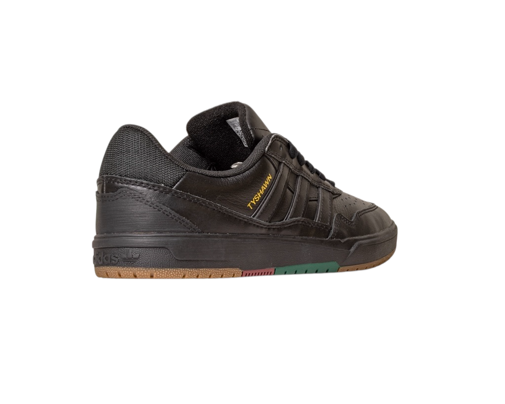 The Tyshawn 2 II Adidas Skateboarding Leather Shoe in Core Black/Core Green features "YOUTH OF PARIS" in yellow on the side, with a brown and green rubber sole, shown from a rear side angle on a white background.