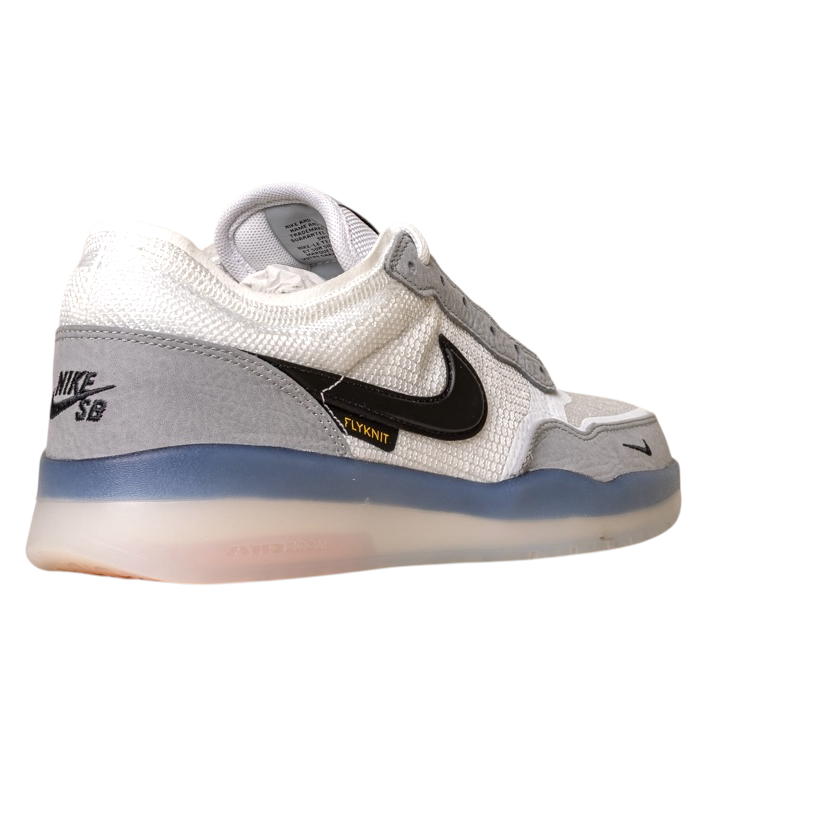 The FV8493-004 Grey White PS8 Nike SB Leather Knit Shoes feature a black swoosh, FLYKNIT text, and a translucent HART outsole, displayed on a white background.