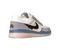 The FV8493-004 Grey White PS8 Nike SB Leather Knit Shoes feature a black swoosh, FLYKNIT text, and a translucent HART outsole, displayed on a white background.