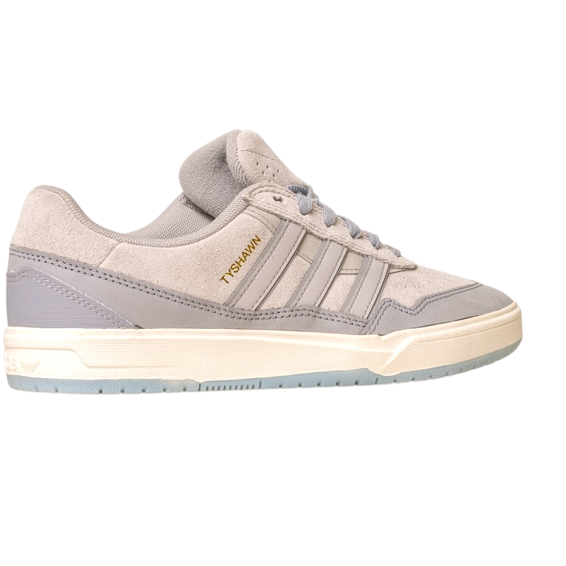 The JI0848 Granite White Tyshawn 2 Adidas Skateboarding Shoe features light gray suede and leather, gray stripes, a white sole, and gold TORSION text on the side, and is shown against a white background.