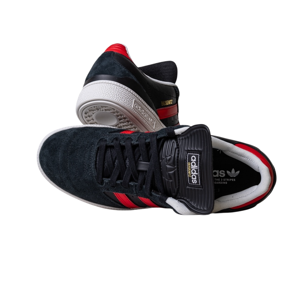 A pair of JH8606 Black Betsc Busenitz Adidas Skateboarding Suede Shoes featuring black suede uppers, red stripes, and white soles. One shoe stands upright, the other tilted to show its side and sole on a white background.