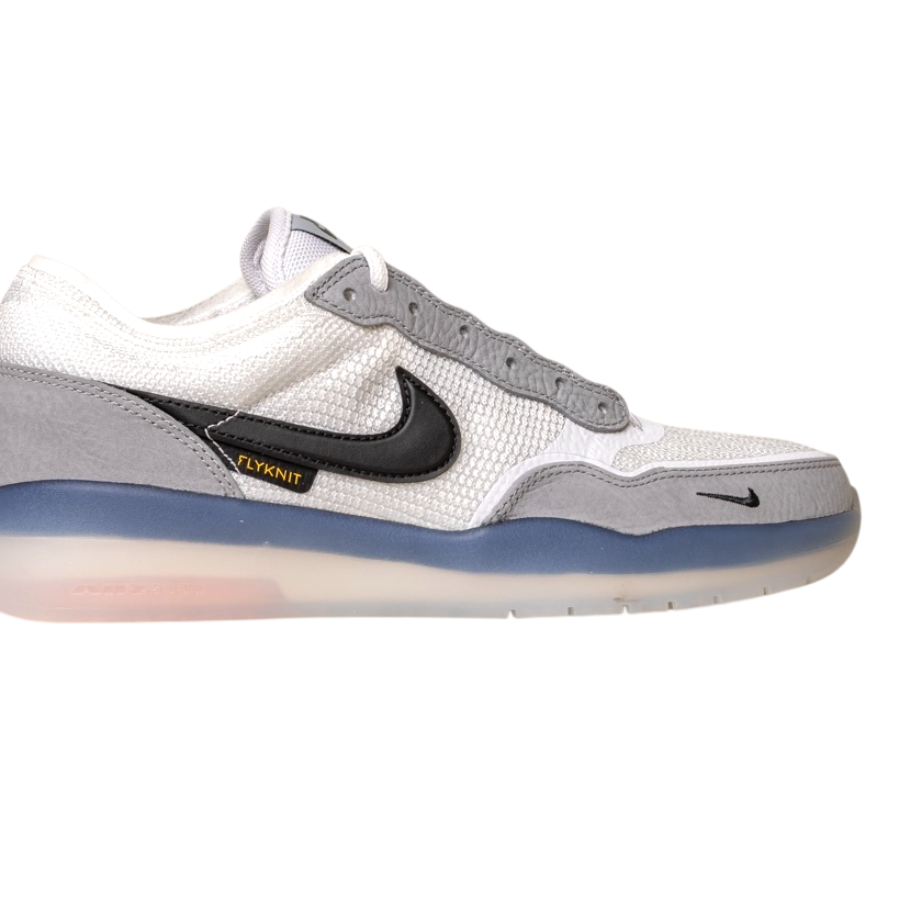 FV8493-004 Grey White PS8 Nike SB Leather Knit Shoes feature a black Swoosh, “Flyknit” label, HART outsole, translucent sole, mesh and suede textures, and a small black Swoosh on the toe.